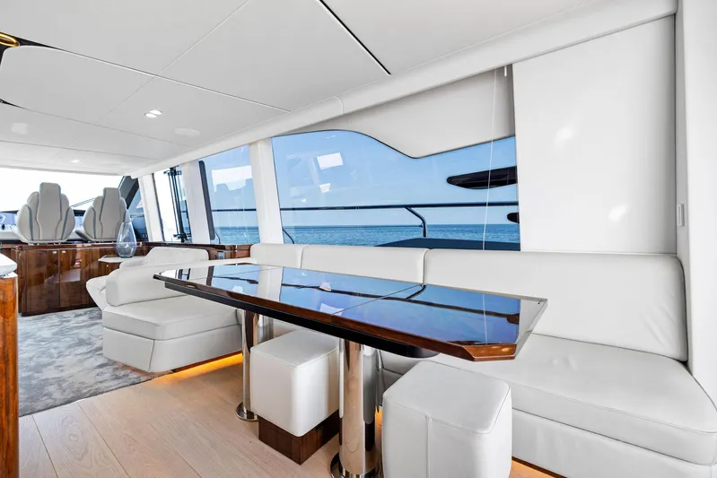  Yacht Photos Pics Luxurious interior of 2024 Fairline Squadron 68 yacht with elegant seating and ocean view.