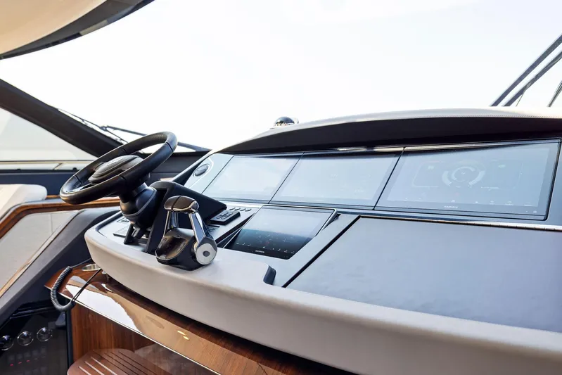  Yacht Photos Pics Fairline 2024 Squadron 68 yacht helm with modern controls and sleek dashboard design.