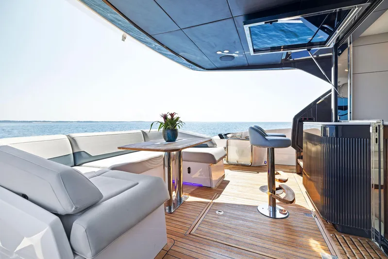  Yacht Photos Pics Luxurious 2024 Fairline Squadron 68 yacht deck with modern seating and ocean view.
