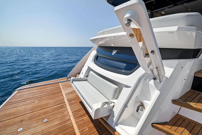 Yacht Photos Pics Fairline 2024 Squadron 68 yacht with teak deck, ocean view, and luxurious seating.