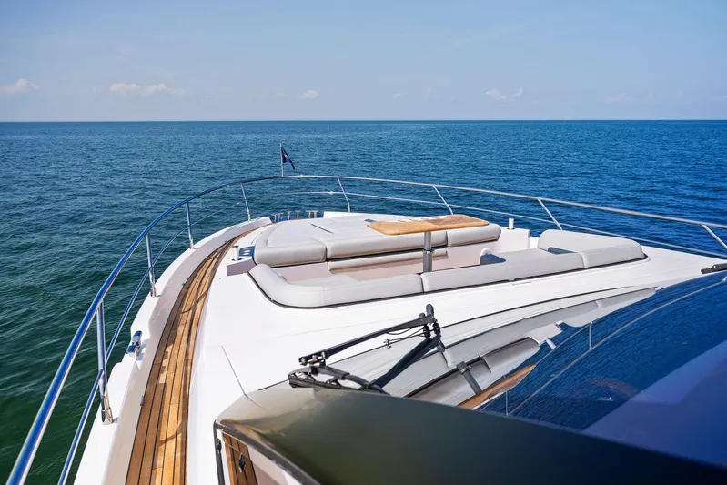  Yacht Photos Pics Fairline 2024 Squadron 68 yacht on open sea, featuring luxurious deck seating.