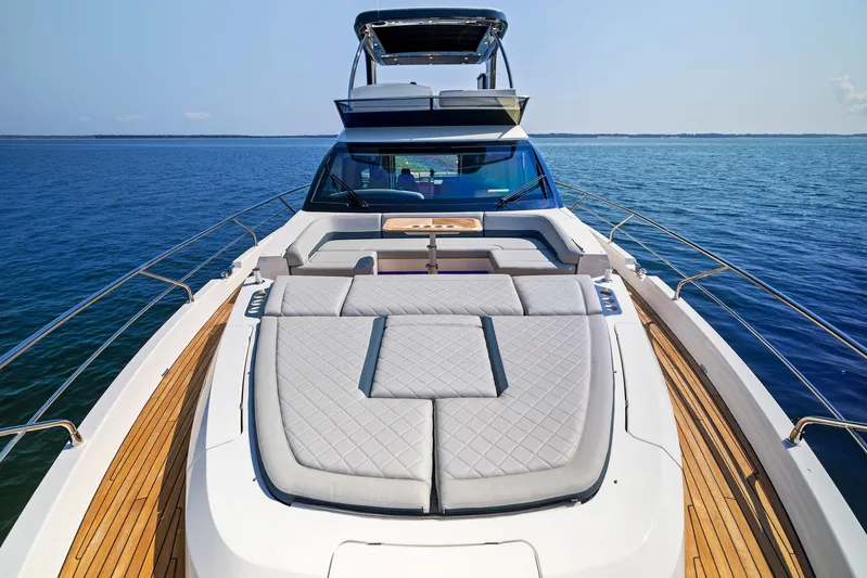  Yacht Photos Pics Luxury Fairline 2024 Squadron 68 yacht with spacious sun deck on open water.