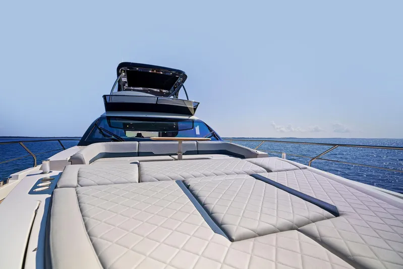  Yacht Photos Pics Luxury Fairline 2024 Squadron 68 yacht on open sea, featuring spacious sunbathing deck.