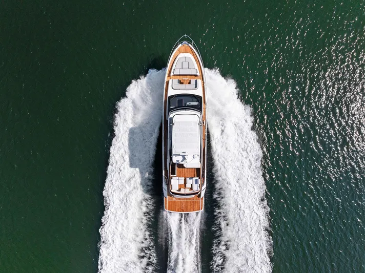  Yacht Photos Pics Aerial view of 2024 Fairline Squadron 68 yacht cruising on open water.
