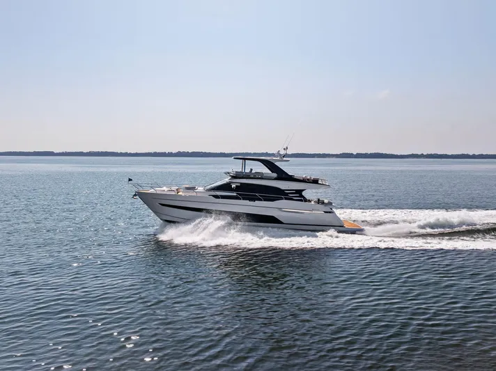  Yacht Photos Pics 2024 Fairline Squadron 68 yacht cruising on open water.