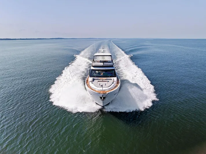  Yacht Photos Pics Fairline 2024 Squadron 68 yacht cruising on open water, aerial view.