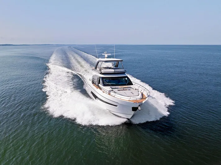  Yacht Photos Pics Fairline 2024 Squadron 68 yacht cruising on open water, showcasing sleek design and performance.