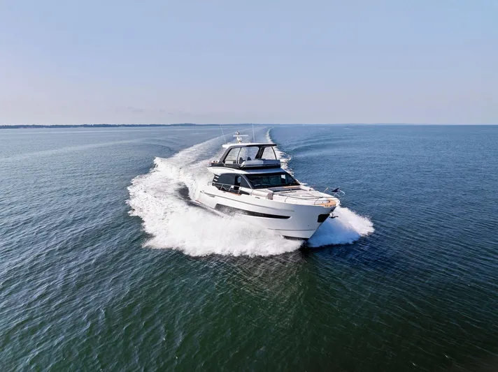  Yacht Photos Pics 2024 Fairline Squadron 68 yacht cruising on open water.