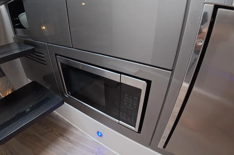  Yacht Photos Pics Modern kitchen area in 2025 Schaefer V44 yacht with built-in microwave.