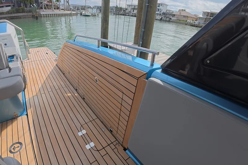  Yacht Photos Pics 2025 Schaefer V44 yacht deck with sleek wood finish and modern design.