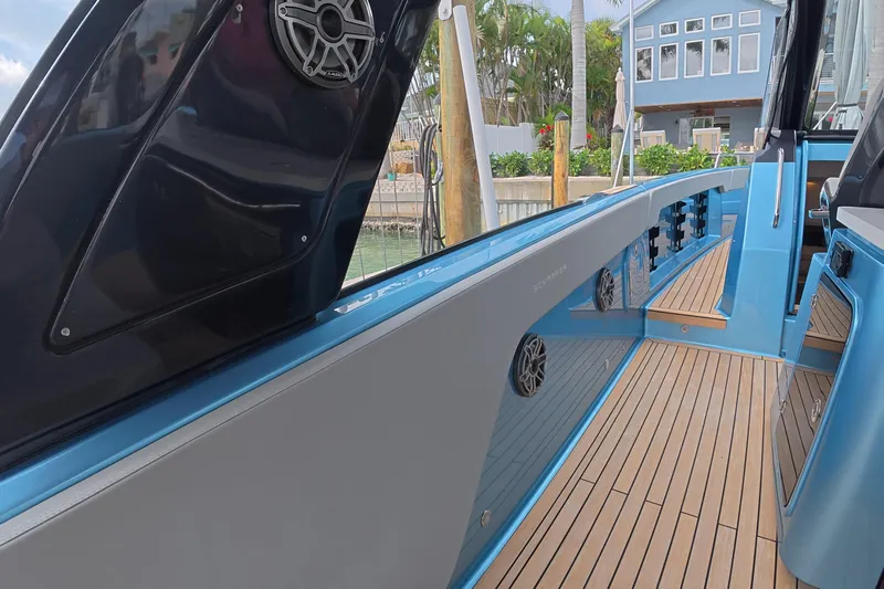  Yacht Photos Pics 2025 Schaefer V44 yacht with sleek design, featuring teak decking and modern audio system.