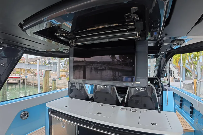  Yacht Photos Pics Interior of 2025 Schaefer V44 yacht with modern entertainment system and seating.