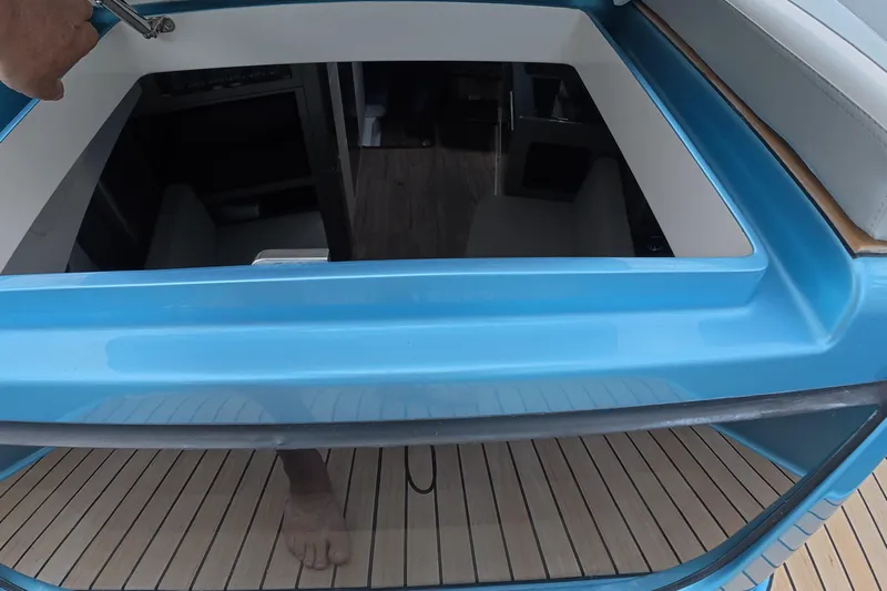 Yacht Photos Pics 2025 Schaefer V44 yacht interior view through open hatch, showcasing modern design.