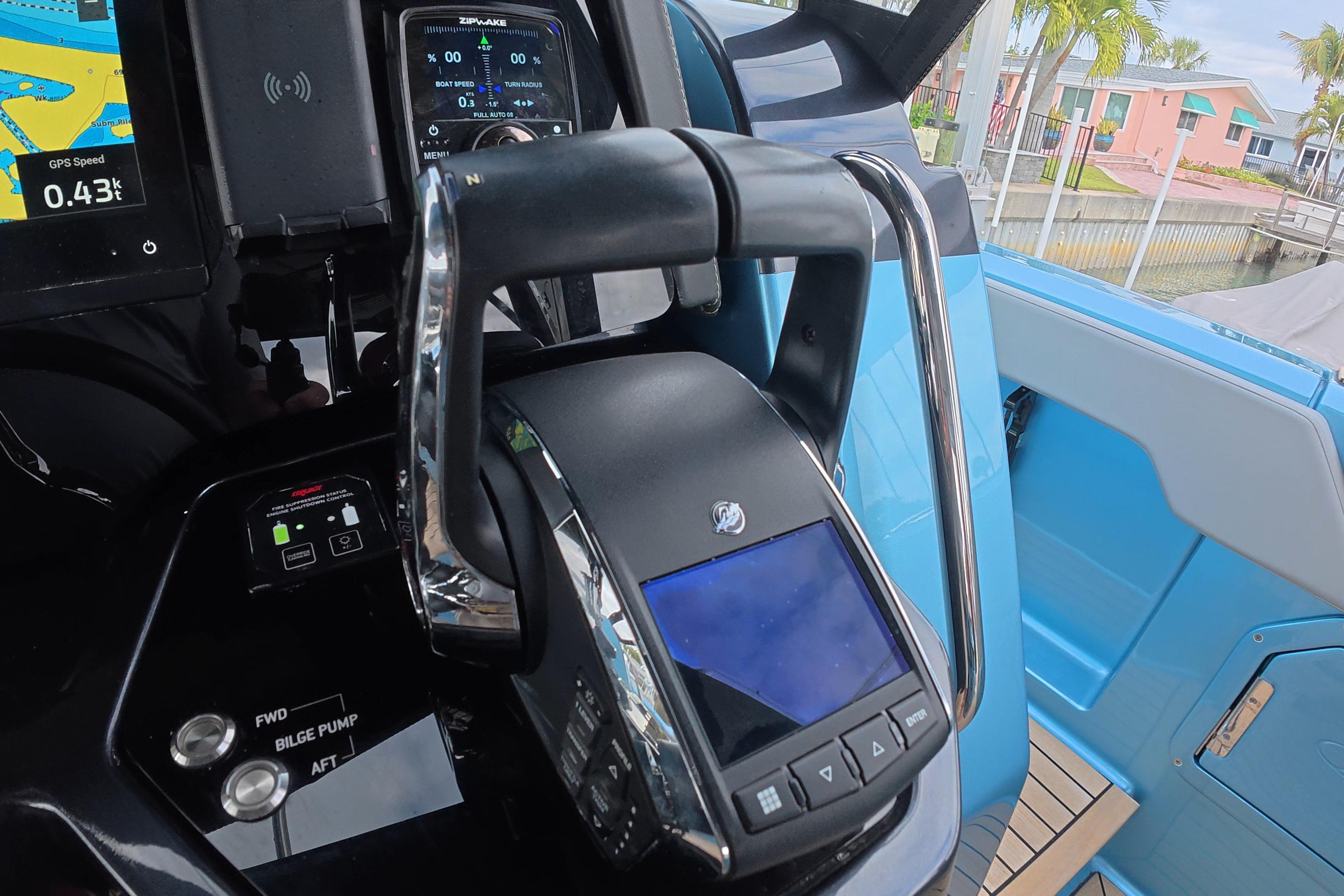 Control panel of 2025 Schaefer V44 yacht with navigation and throttle systems.