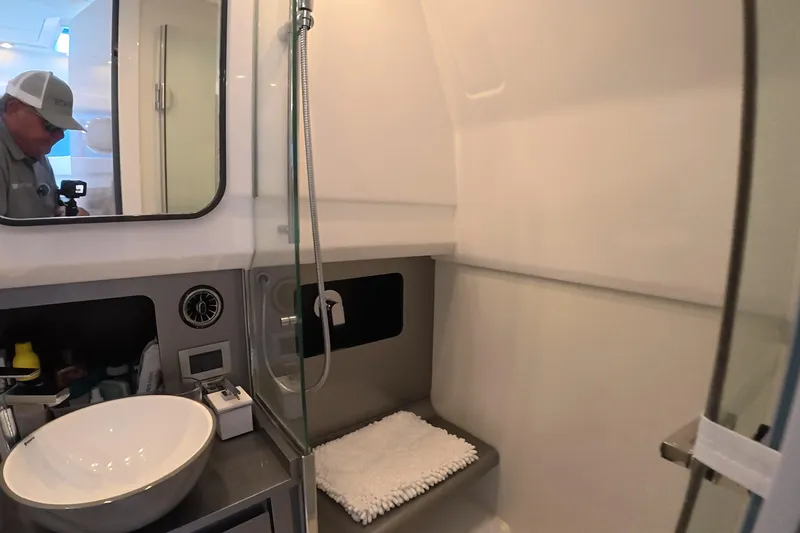  Yacht Photos Pics Modern bathroom interior of 2025 Schaefer V44 yacht with sleek design and amenities.