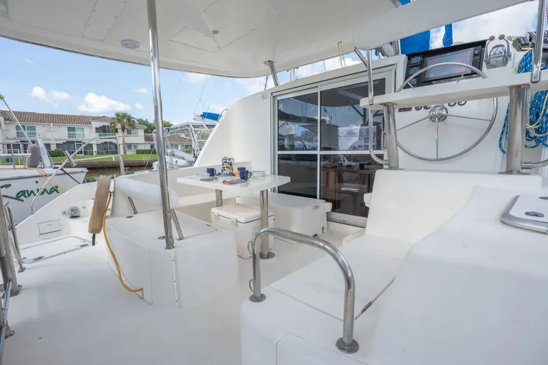 Lovely Cruise Yacht Photos Pics Spacious deck of 2011 Leopard 38 catamaran with seating and helm station.