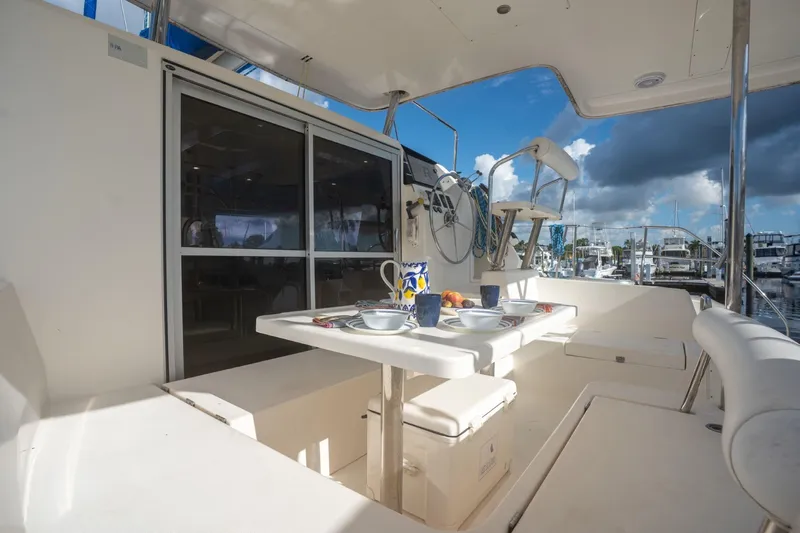 Lovely Cruise Yacht Photos Pics Outdoor dining area on a 2011 Leopard 38 yacht, featuring a table set for breakfast.