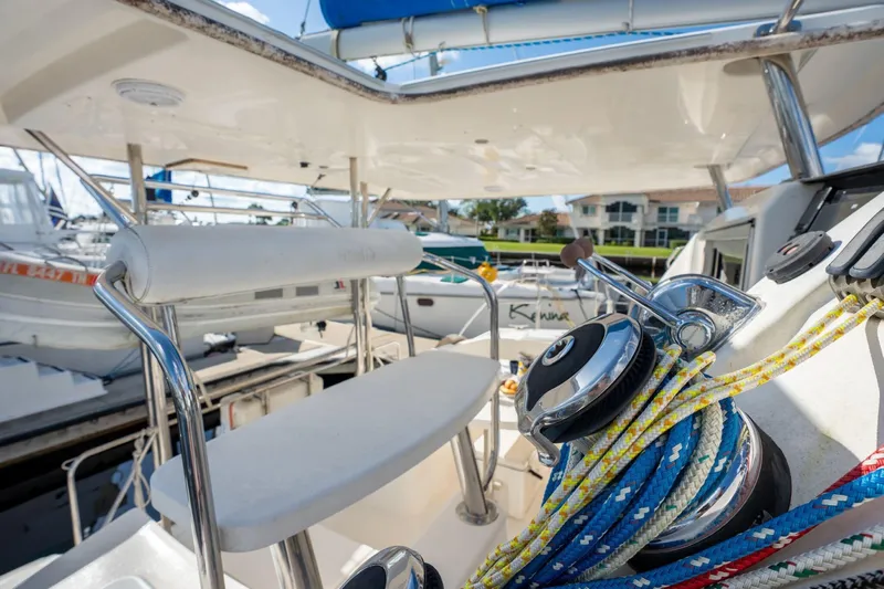 Lovely Cruise Yacht Photos Pics Cockpit view of 2011 Leopard 38 sailboat with ropes and winch in marina.