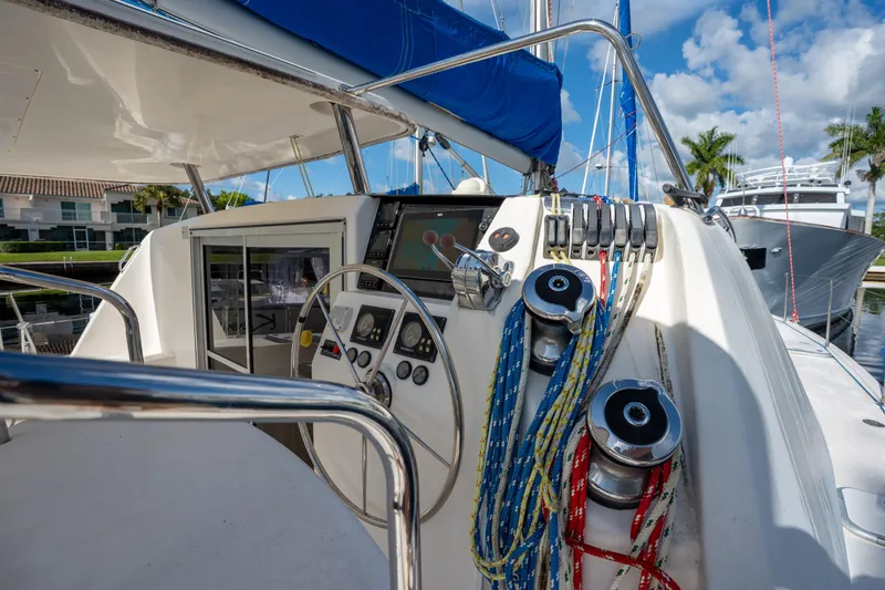 Lovely Cruise Yacht Photos Pics Cockpit of 2011 Leopard 38 sailboat with steering wheel and colorful ropes.
