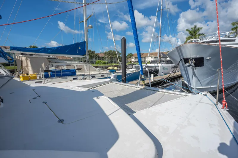 Lovely Cruise Yacht Photos Pics 2011 Leopard 38 catamaran docked at marina under blue sky.