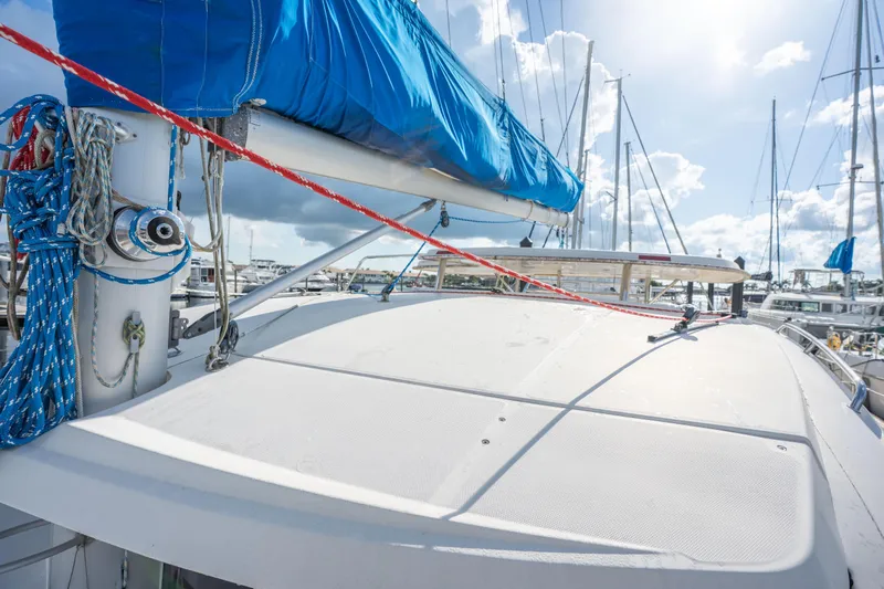 Lovely Cruise Yacht Photos Pics Sailboat deck of 2011 Leopard 38 with blue sail cover in marina.