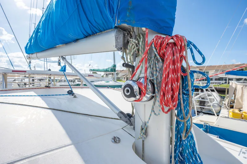 Lovely Cruise Yacht Photos Pics Sailboat deck with ropes and winch, Leopard 38 model, 2011, under clear blue sky.