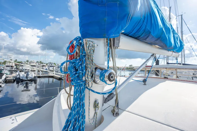 Lovely Cruise Yacht Photos Pics Sailboat deck with ropes and blue sail cover, Leopard 38, 2011 model, in marina.