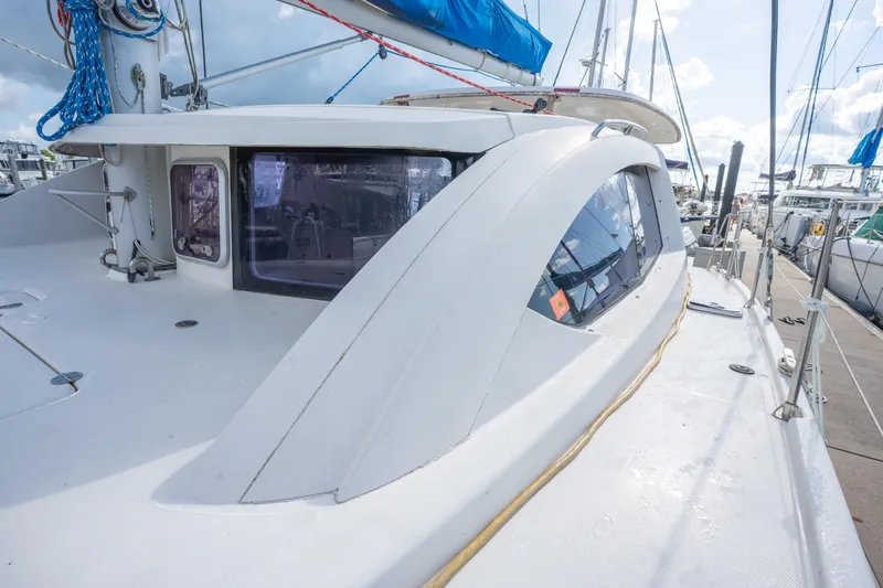 Lovely Cruise Yacht Photos Pics 2011 Leopard 38 catamaran deck with sleek design and blue rigging in marina.