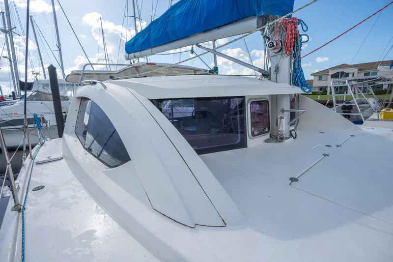 Lovely Cruise Yacht Photos Pics 2011 Leopard 38 catamaran docked, featuring sleek design and blue sail cover.