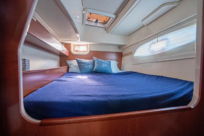 Lovely Cruise Yacht Photos Pics Cozy cabin interior of 2011 Leopard 38 yacht with blue bedding and pillows.