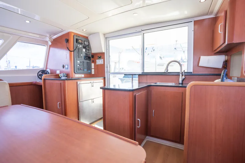 Lovely Cruise Yacht Photos Pics Interior of 2011 Leopard 38 yacht with modern kitchen and control panel.