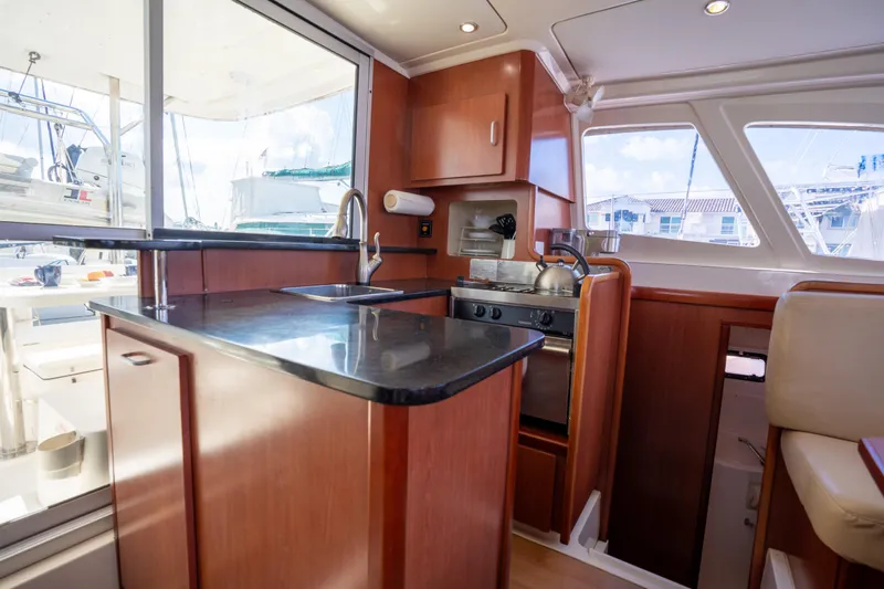Lovely Cruise Yacht Photos Pics Modern kitchen interior of 2011 Leopard 38 catamaran with sleek countertops and appliances.