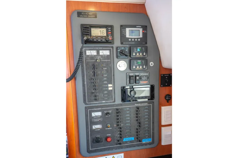 Lovely Cruise Yacht Photos Pics Electrical control panel on a 2011 Leopard 38 yacht, featuring various switches and displays.