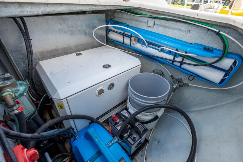 Lovely Cruise Yacht Photos Pics Engine compartment of a 2011 Leopard 38 boat with equipment and wiring.