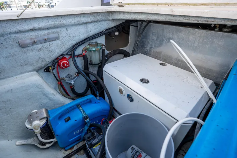 Lovely Cruise Yacht Photos Pics Engine compartment of a 2011 Leopard 38 boat with visible machinery and wiring.
