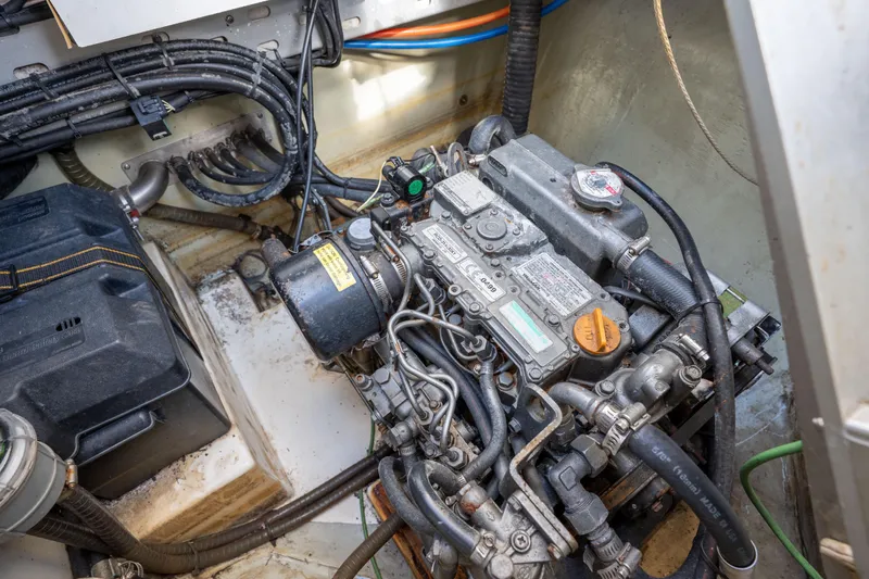Lovely Cruise Yacht Photos Pics Engine compartment of a 2011 Leopard 38 boat, showcasing detailed mechanical components.