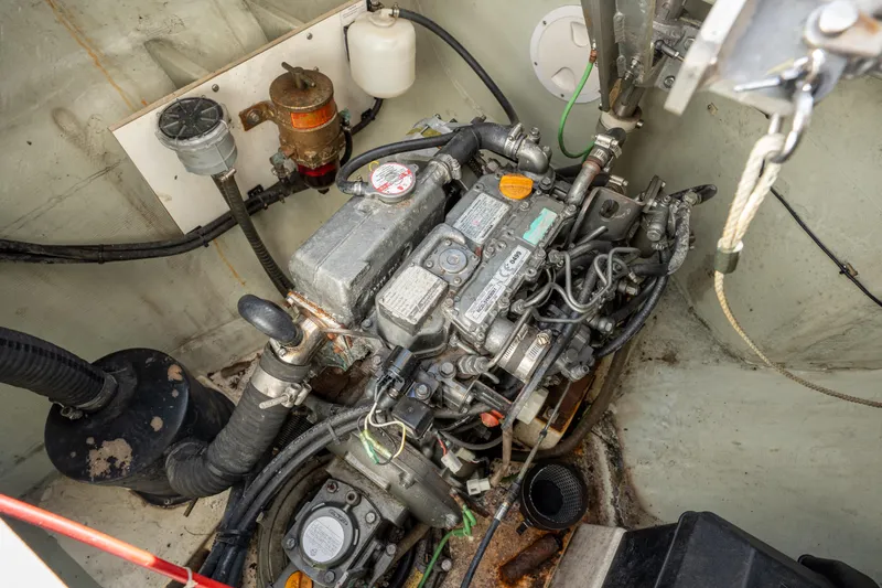 Lovely Cruise Yacht Photos Pics Engine compartment of a 2011 Leopard 38 catamaran, showcasing mechanical components and wiring.