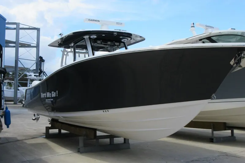 "here We Go" Yacht Photos Pics 2021 Sportsman Open 352 Center Console boat on display at a marina.