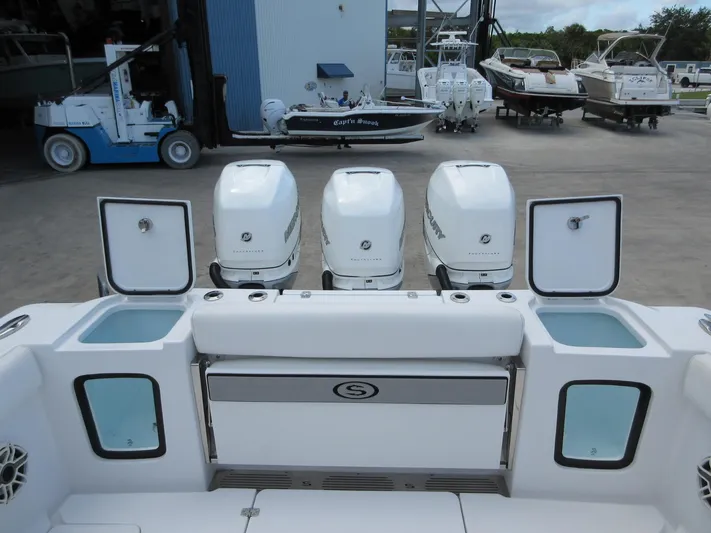 "here We Go" Yacht Photos Pics 2021 Sportsman Open 352 Center Console with triple Mercury outboard engines at a marina.