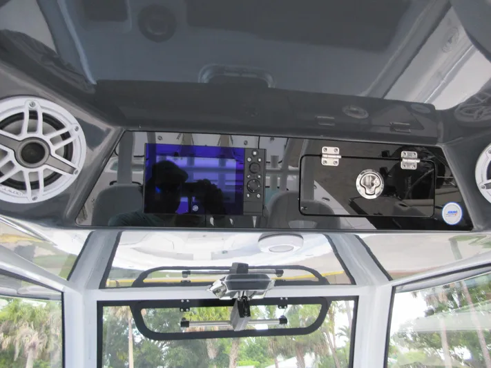 "here We Go" Yacht Photos Pics 2021 Sportsman Open 352 Center Console dashboard with speakers and control panel.