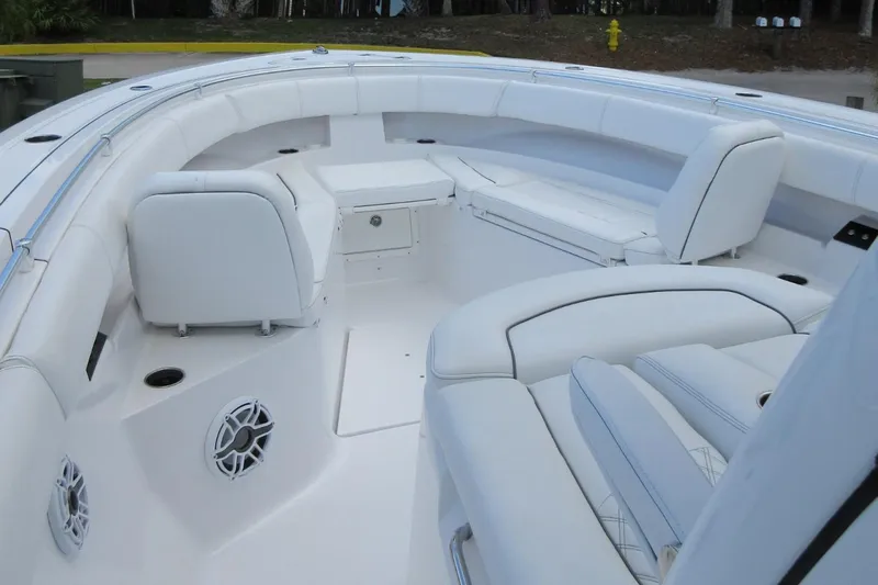 "here We Go" Yacht Photos Pics 2021 Sportsman Open 352 Center Console boat interior with white seating and speakers.