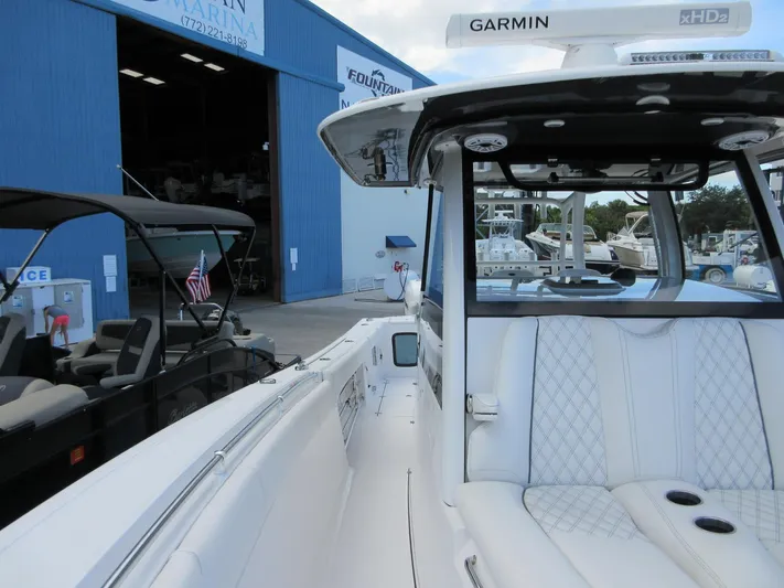 "here We Go" Yacht Photos Pics 2021 Sportsman Open 352 Center Console boat at marina, featuring Garmin equipment.