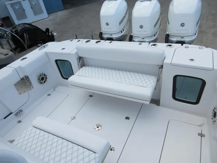 "here We Go" Yacht Photos Pics 2021 Sportsman Open 352 Center Console boat interior with seating and Mercury engines.