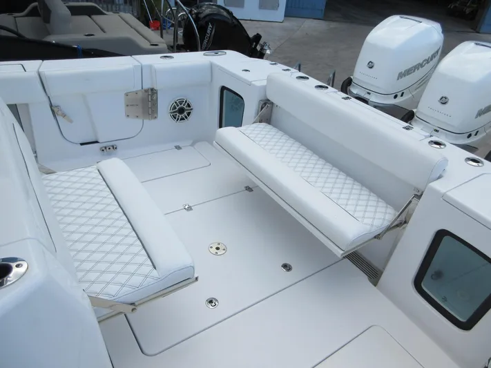 "here We Go" Yacht Photos Pics 2021 Sportsman Open 352 Center Console with white seating and Mercury engines.