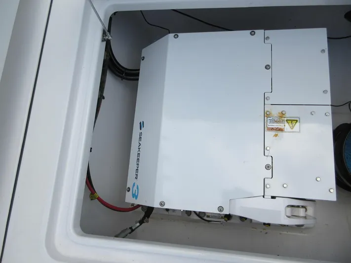 "here We Go" Yacht Photos Pics Seakeeper 3 stabilizer in 2021 Sportsman Open 352 Center Console boat compartment.