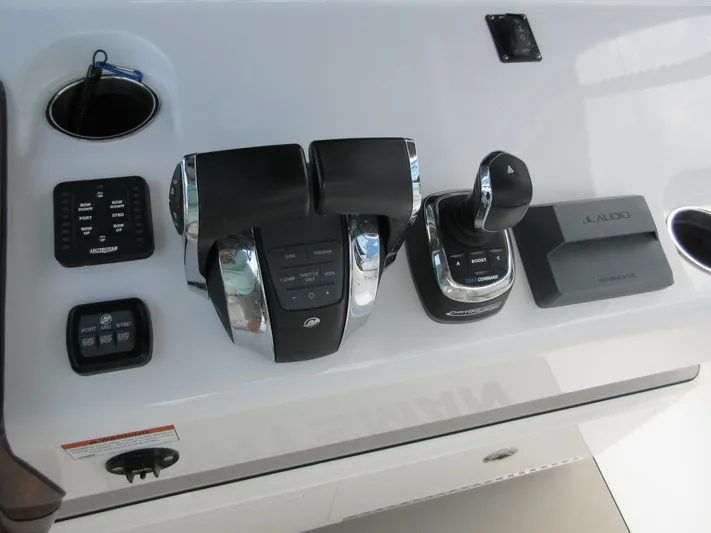 "here We Go" Yacht Photos Pics Control panel of 2021 Sportsman Open 352 Center Console boat with throttle and joystick.
