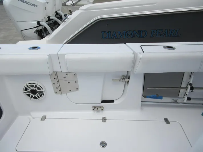 "here We Go" Yacht Photos Pics 2021 Sportsman Open 352 Center Console boat interior with seating and speaker.