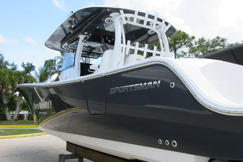 "here We Go" Yacht Photos Pics 2021 Sportsman Open 352 Center Console boat, sleek design, parked outdoors.
