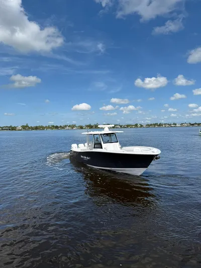 "here We Go" Yacht Photos Pics 2021 Sportsman Open 352 Center Console boat cruising on a sunny day.