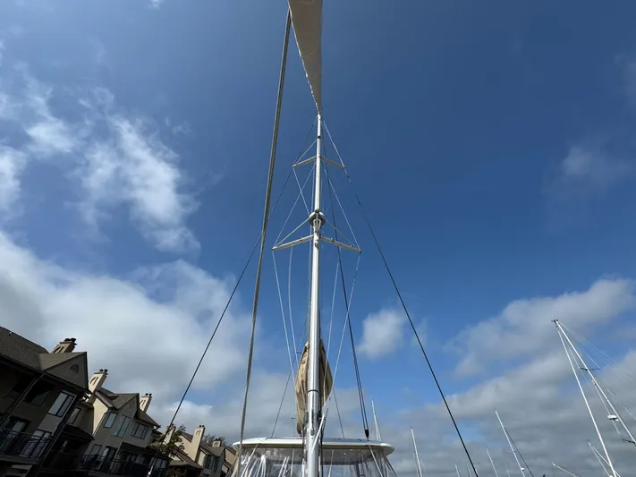Eden Yacht Photos Pics Sailboat mast of 2022 Lagoon 46 against a clear blue sky.